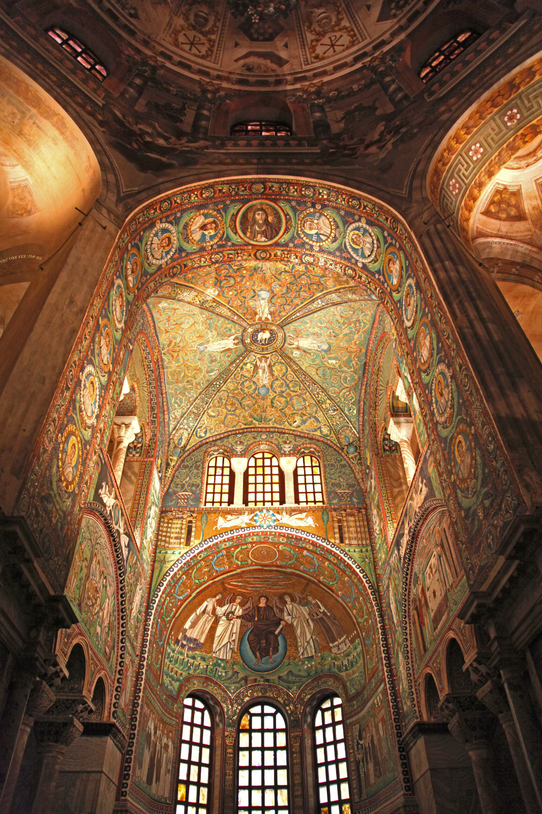 intrados of the great triumphal arch depicting Christ Jesus with the Twelve Apostles and Saints Gervasius and Protasius in the Basilica of San Vitale in Ravenna