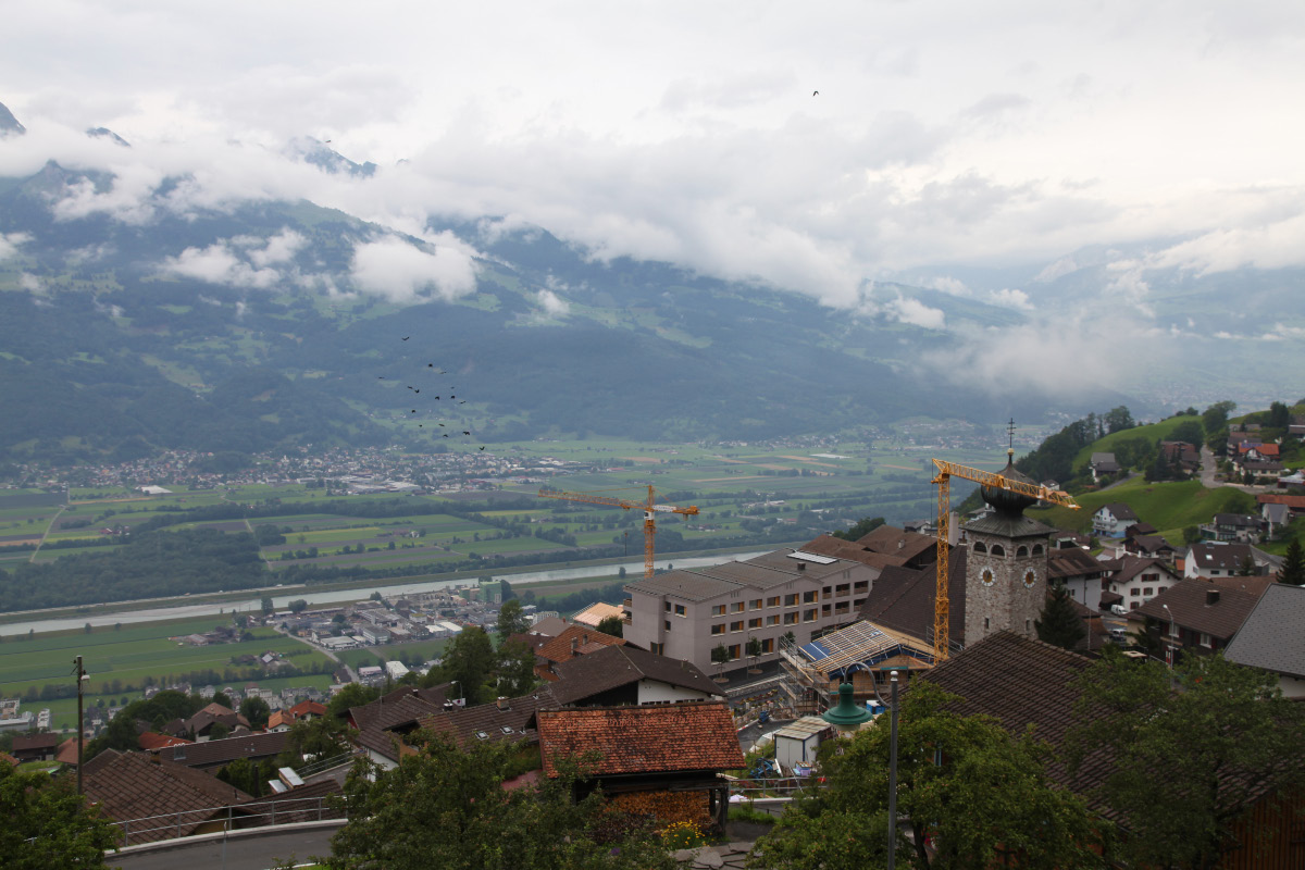 Looking from Leichtenstein toward the west, the Rhein River, Sevelen in Switzerland and then the Swiss Alps